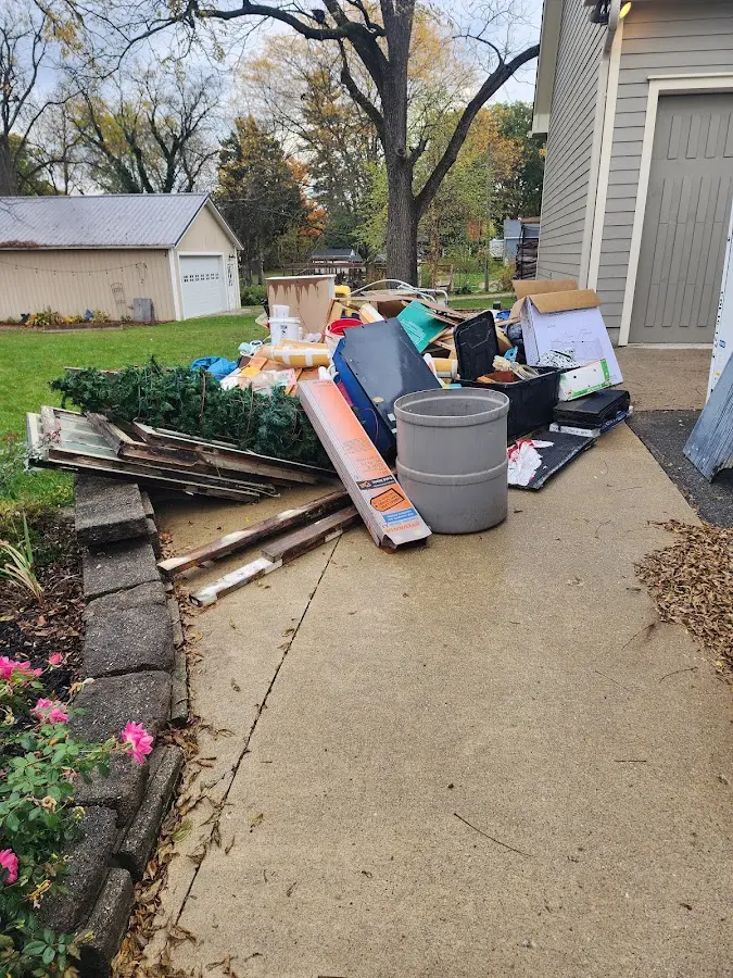 Dumpster being loaded with debris for Estate Cleanout Dumpster Rental in Port Jervis